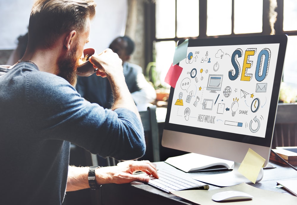 a man doing SEO in a computer in a digital marketing agency, Searching Engine Optimizing SEO Browsing Concept